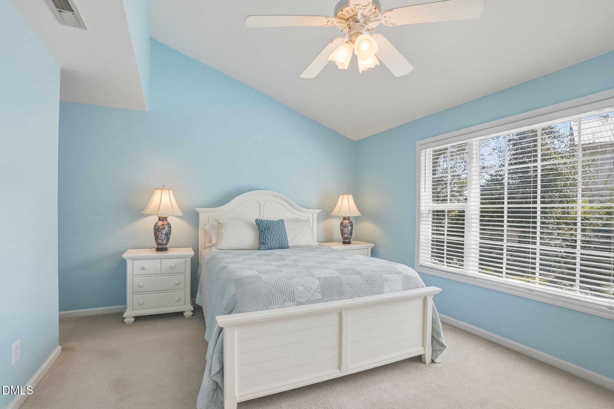 805 Sloop Pointe Lane Kure Beach, NC 28449 - Photo 7 of 20 a spacious bedroom with a bed and a window