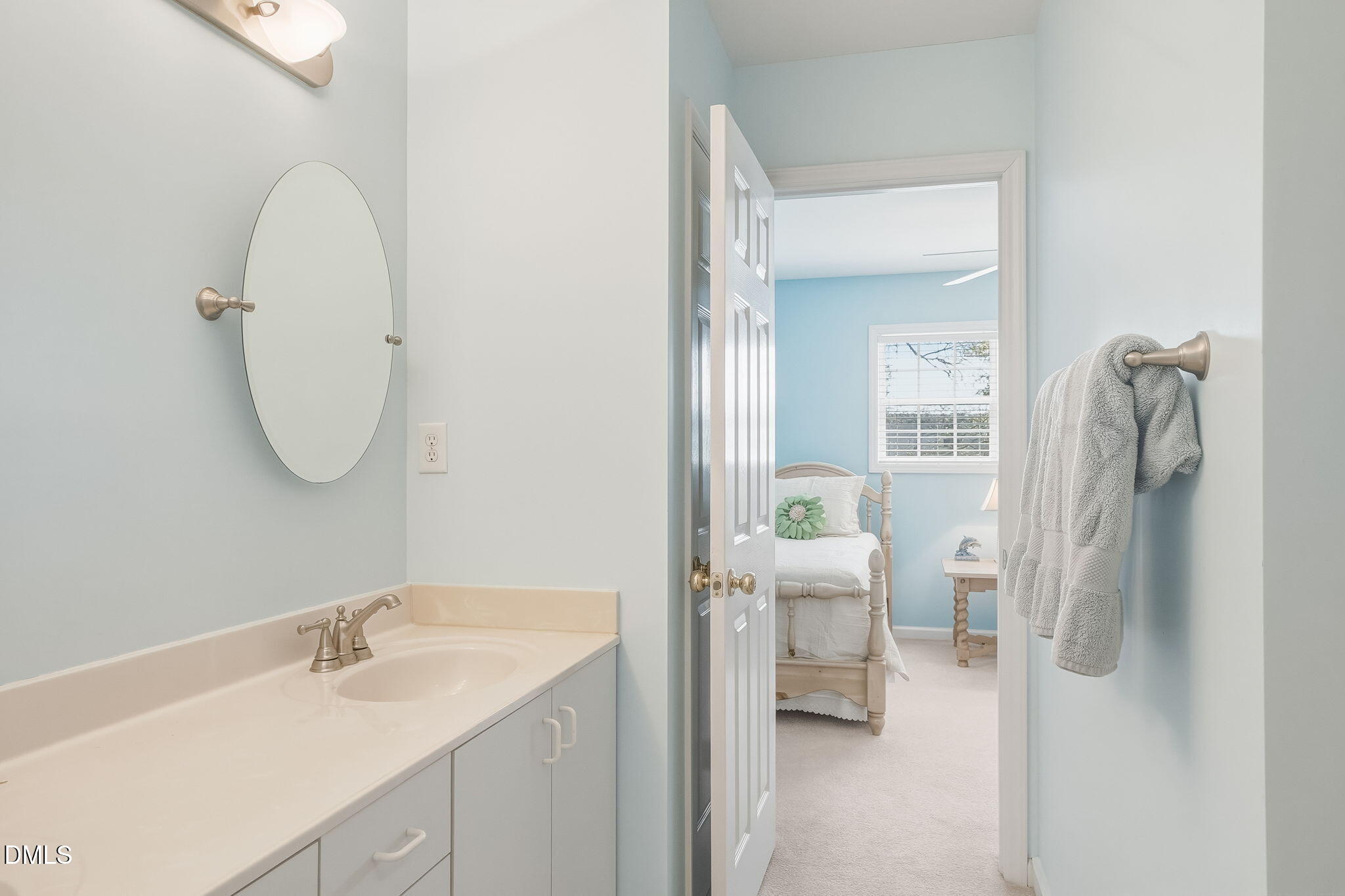 805 Sloop Pointe Lane Kure Beach, NC 28449 - Photo 8 of 20 a bathroom with a sink and mirror