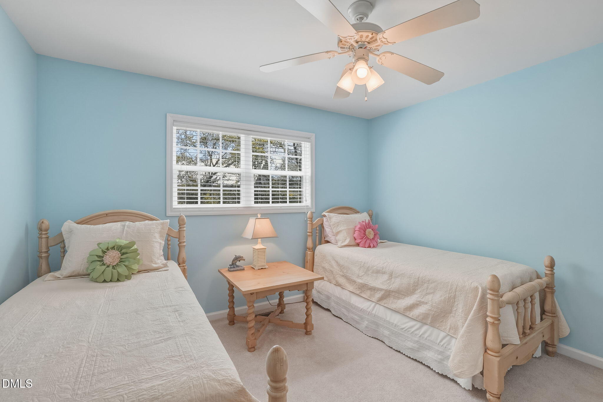 805 Sloop Pointe Lane Kure Beach, NC 28449 - Photo 9 of 20 a bedroom with a bed and a chandelier