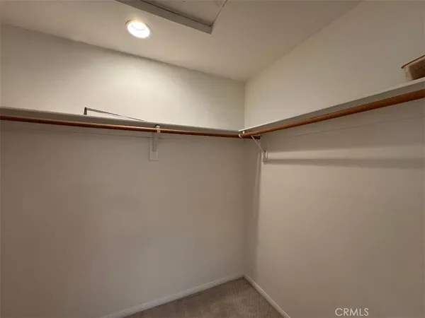a bathroom with a double vanity sink and mirror