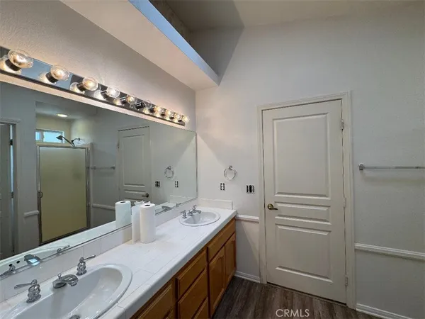 a bathroom with a shower and closet