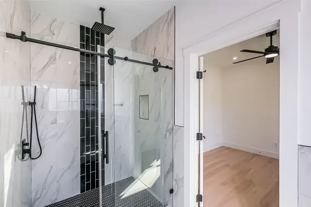 a bathroom with a shower and toilet