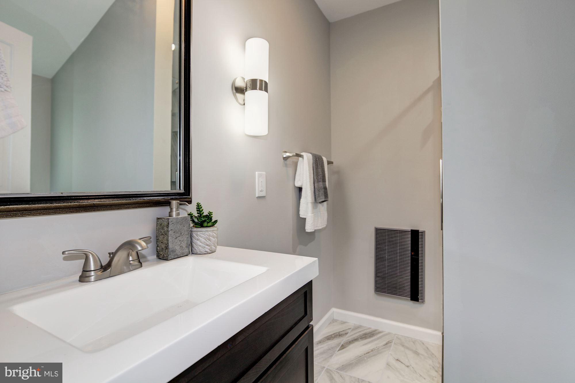 1301 Midmeadow Road Towson, MD 21286 - Photo 17 of 30 a bathroom with a sink and a mirror