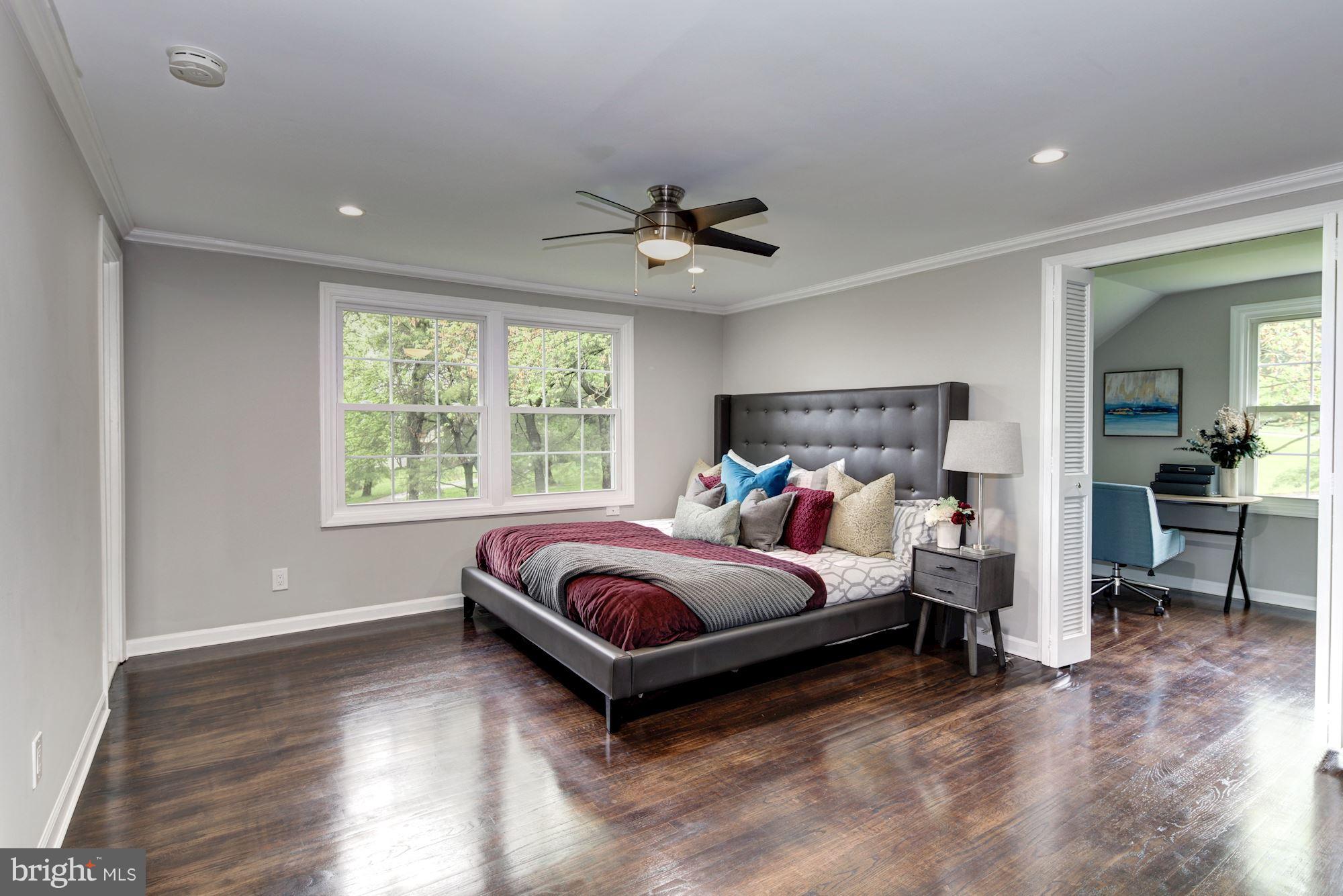 1301 Midmeadow Road Towson, MD 21286 - Photo 20 of 30 a bed room with a bed and a chandelier