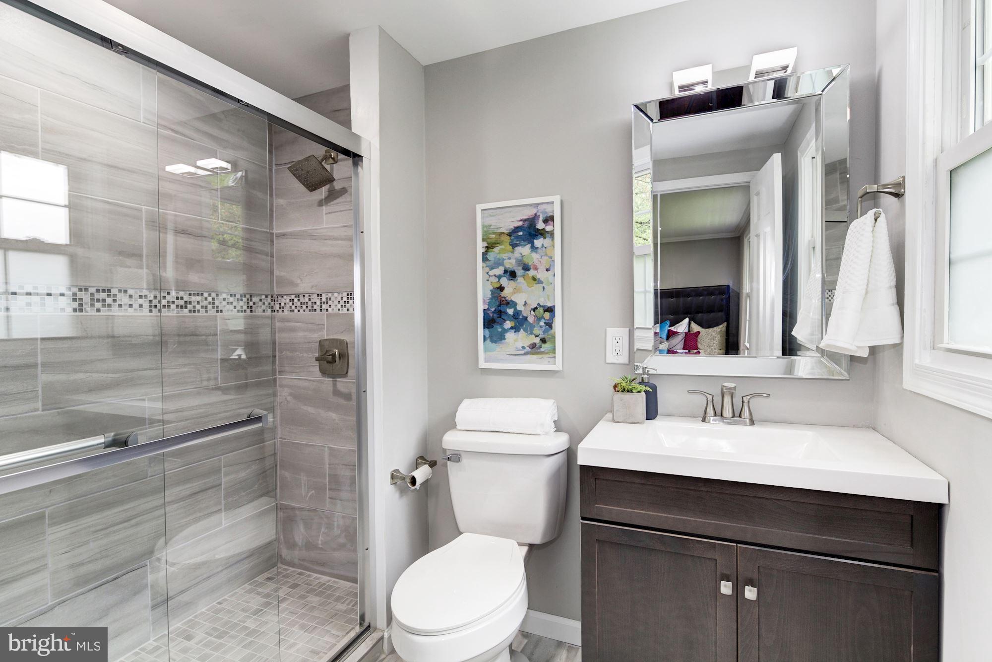 1301 Midmeadow Road Towson, MD 21286 - Photo 22 of 30 a bathroom with a sink a toilet and shower