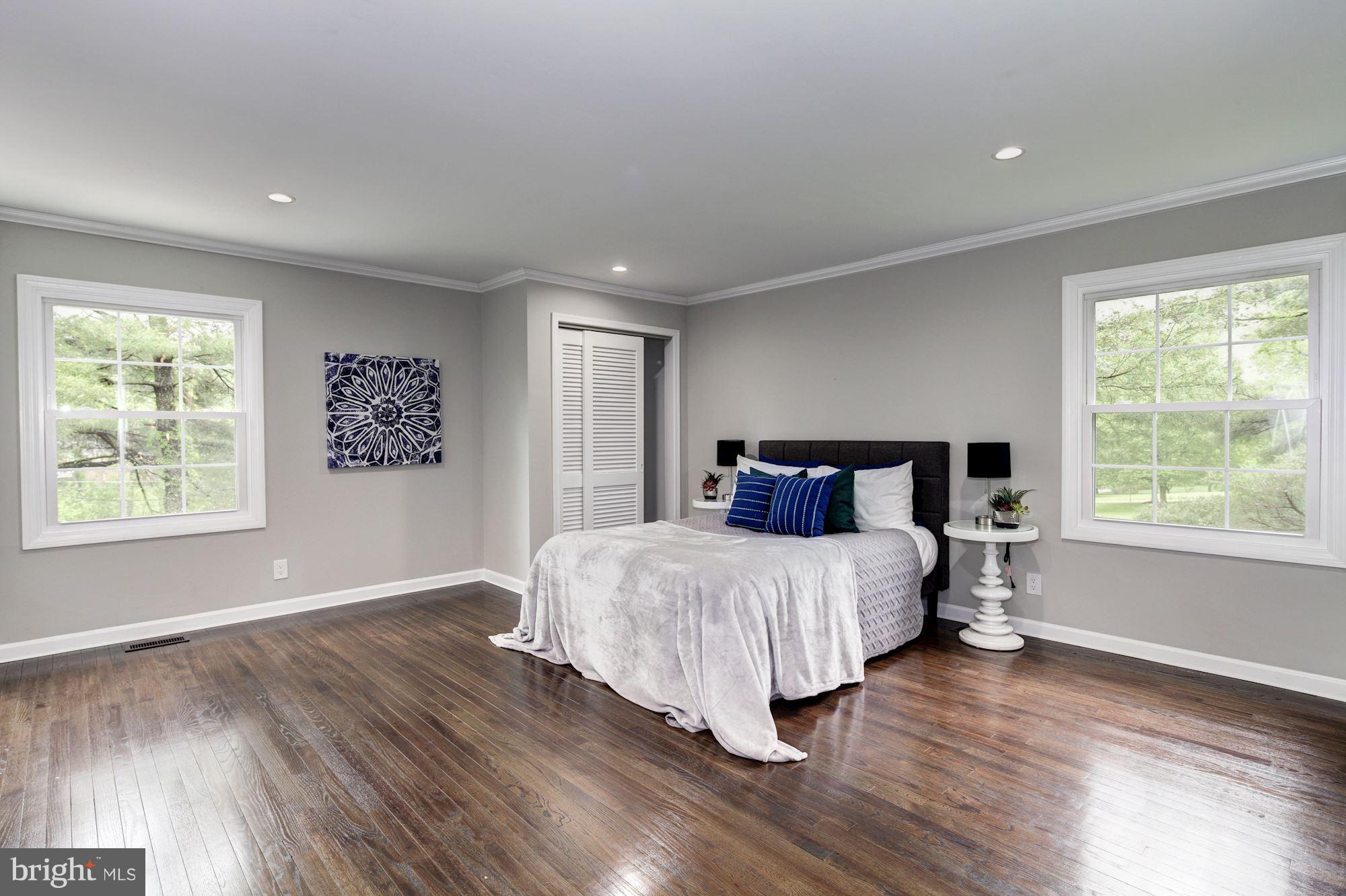 1301 Midmeadow Road Towson, MD 21286 - Photo 23 of 30 a spacious bedroom with a large bed and a window