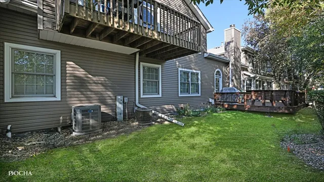 a view of house with backyard