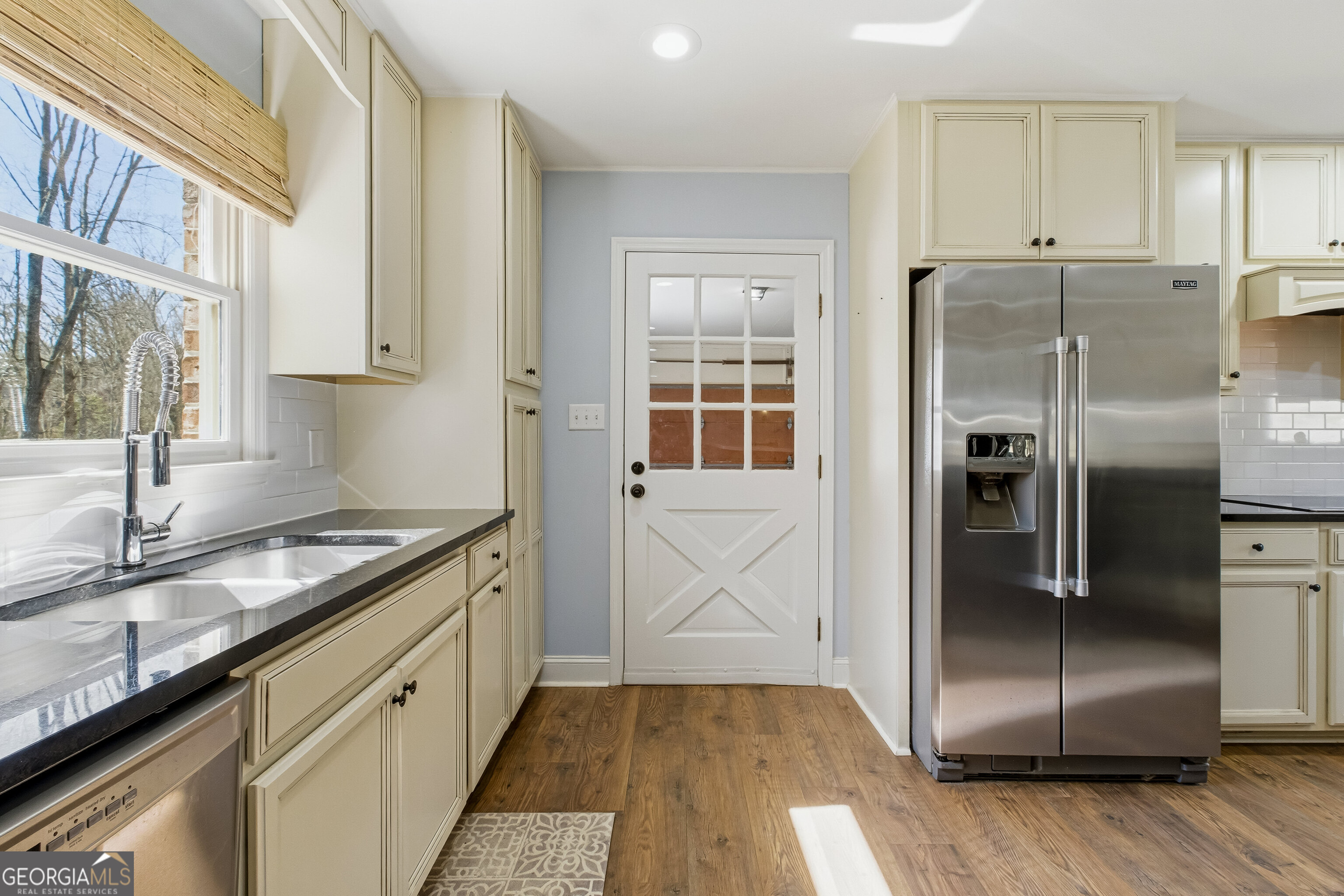 3302 Hickory Point Gainesville, GA 30506 - Photo 16 of 73 a kitchen with granite countertop a refrigerator and a sink