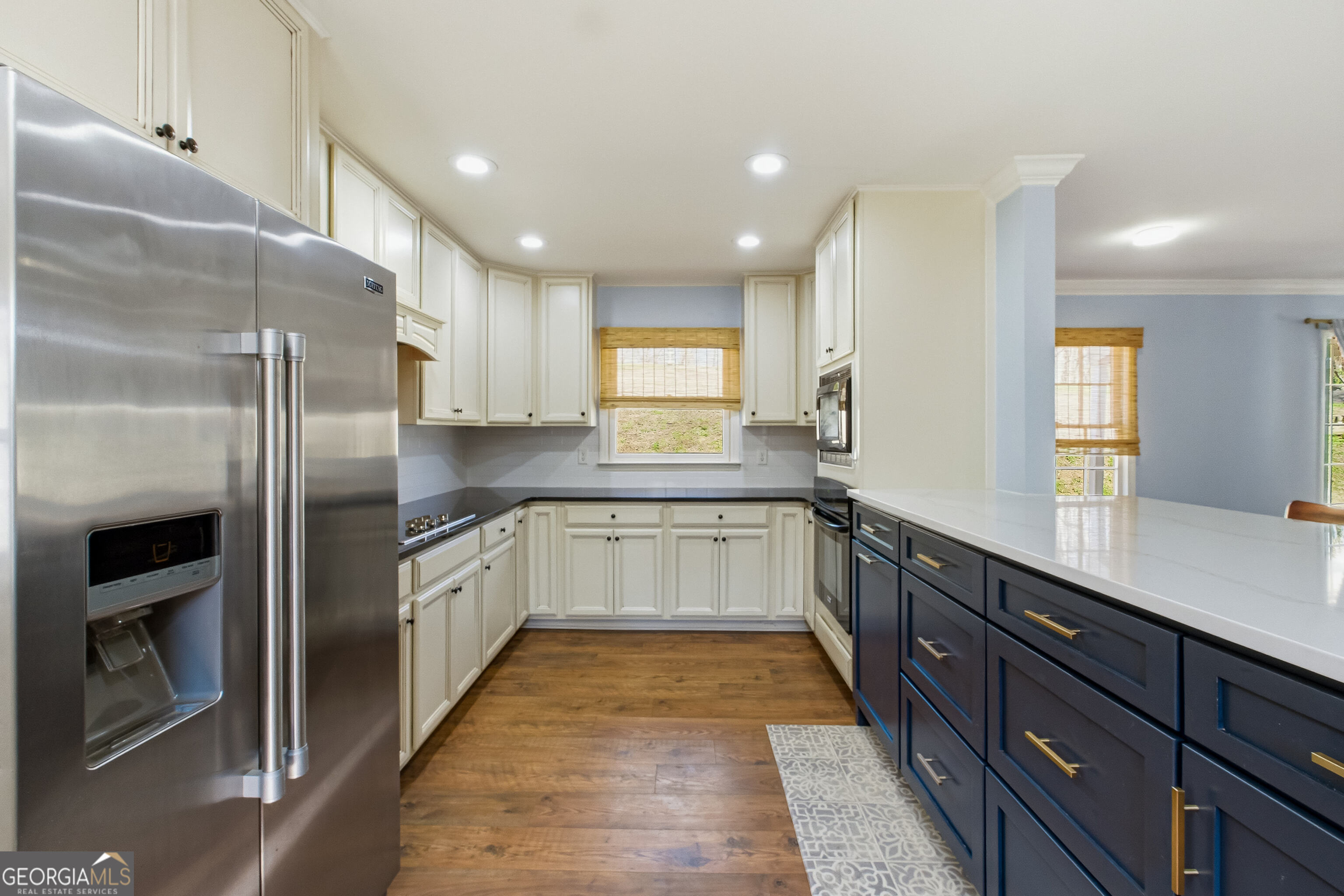 3302 Hickory Point Gainesville, GA 30506 - Photo 17 of 73 a large kitchen with a large counter top a sink stainless steel appliances and cabinets