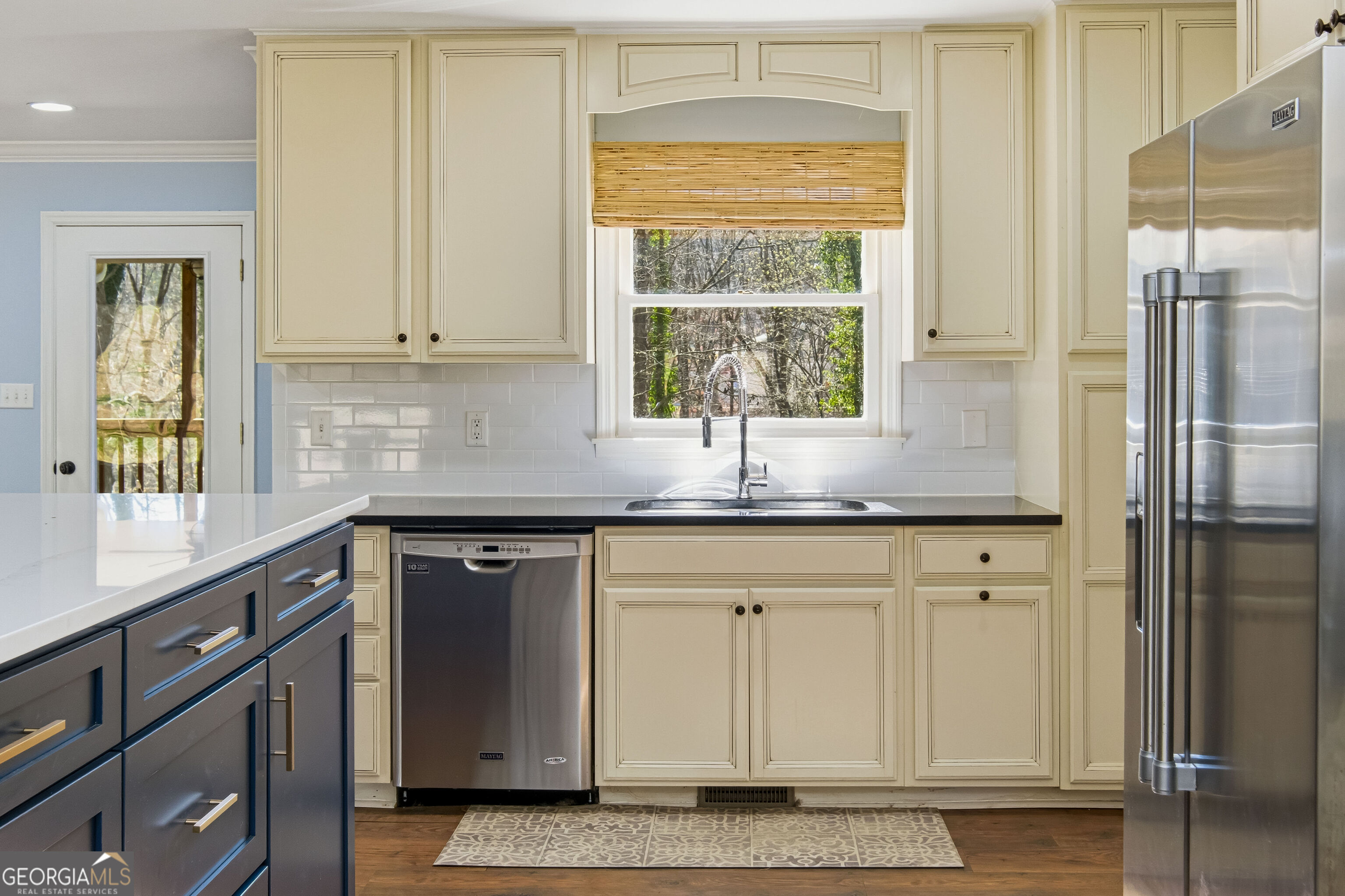 3302 Hickory Point Gainesville, GA 30506 - Photo 19 of 73 a kitchen with stainless steel appliances granite countertop a sink and a granite counter tops