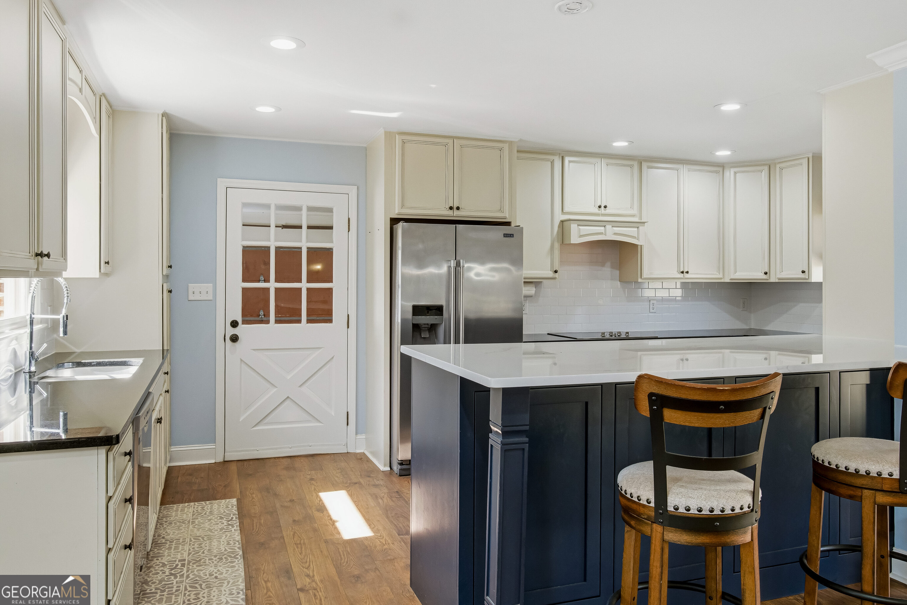 3302 Hickory Point Gainesville, GA 30506 - Photo 22 of 73 a kitchen with a sink cabinets and stainless steel appliances