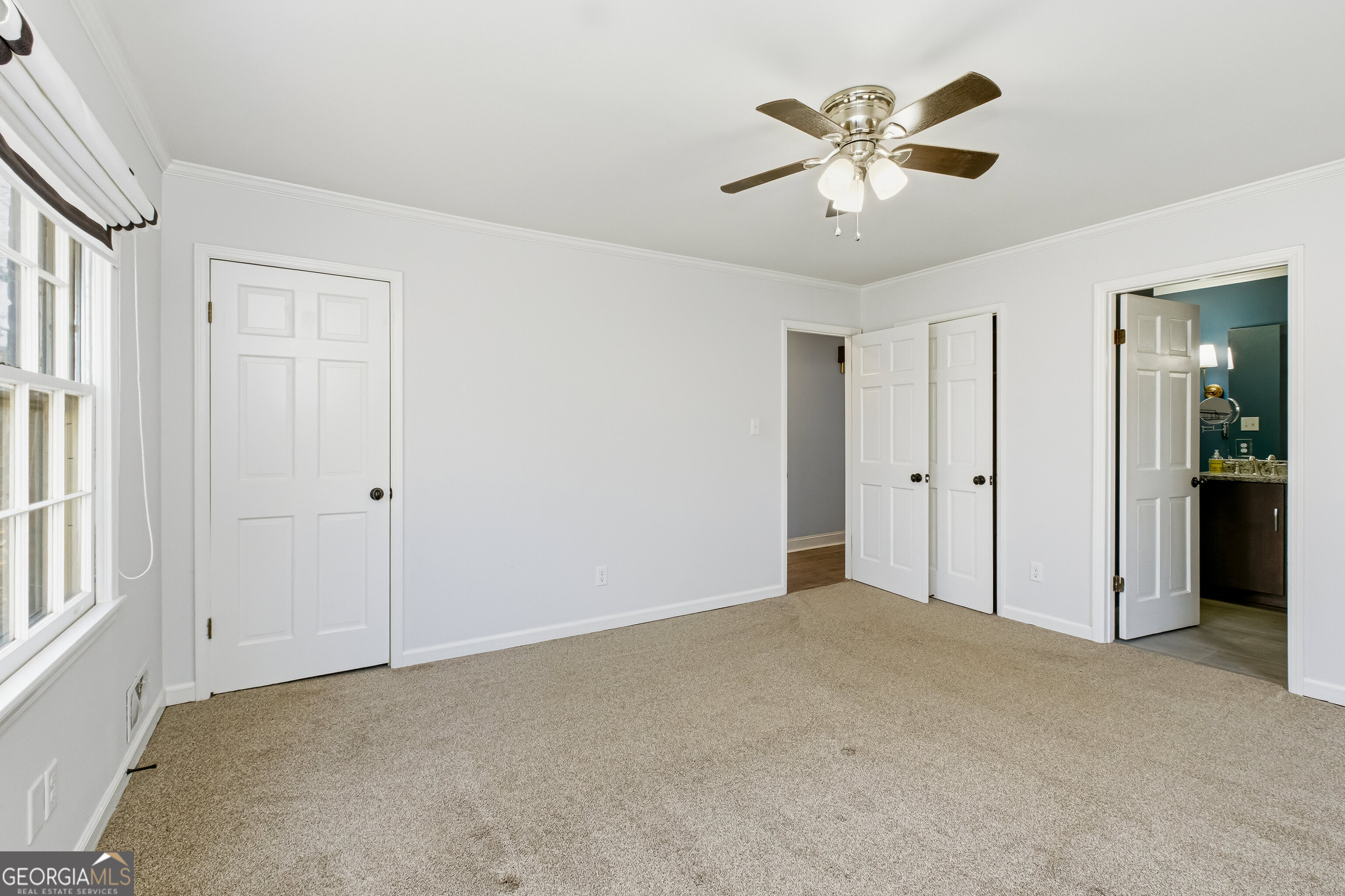 3302 Hickory Point Gainesville, GA 30506 - Photo 27 of 73 a view of an empty room with a ceiling fan
