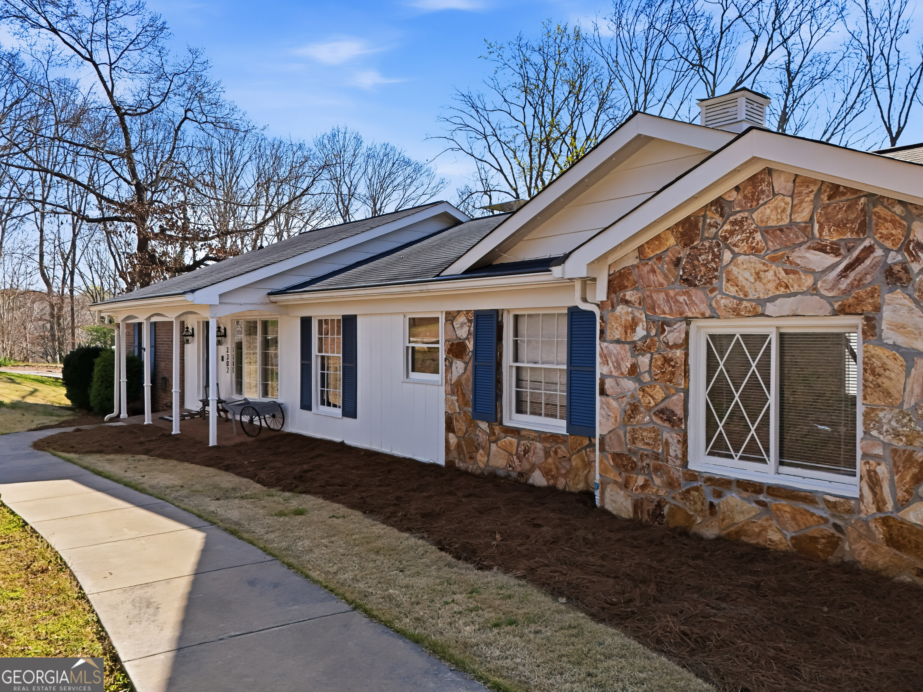 3302 Hickory Point Gainesville, GA 30506 - Photo 4 of 73 a front view of a house with garden