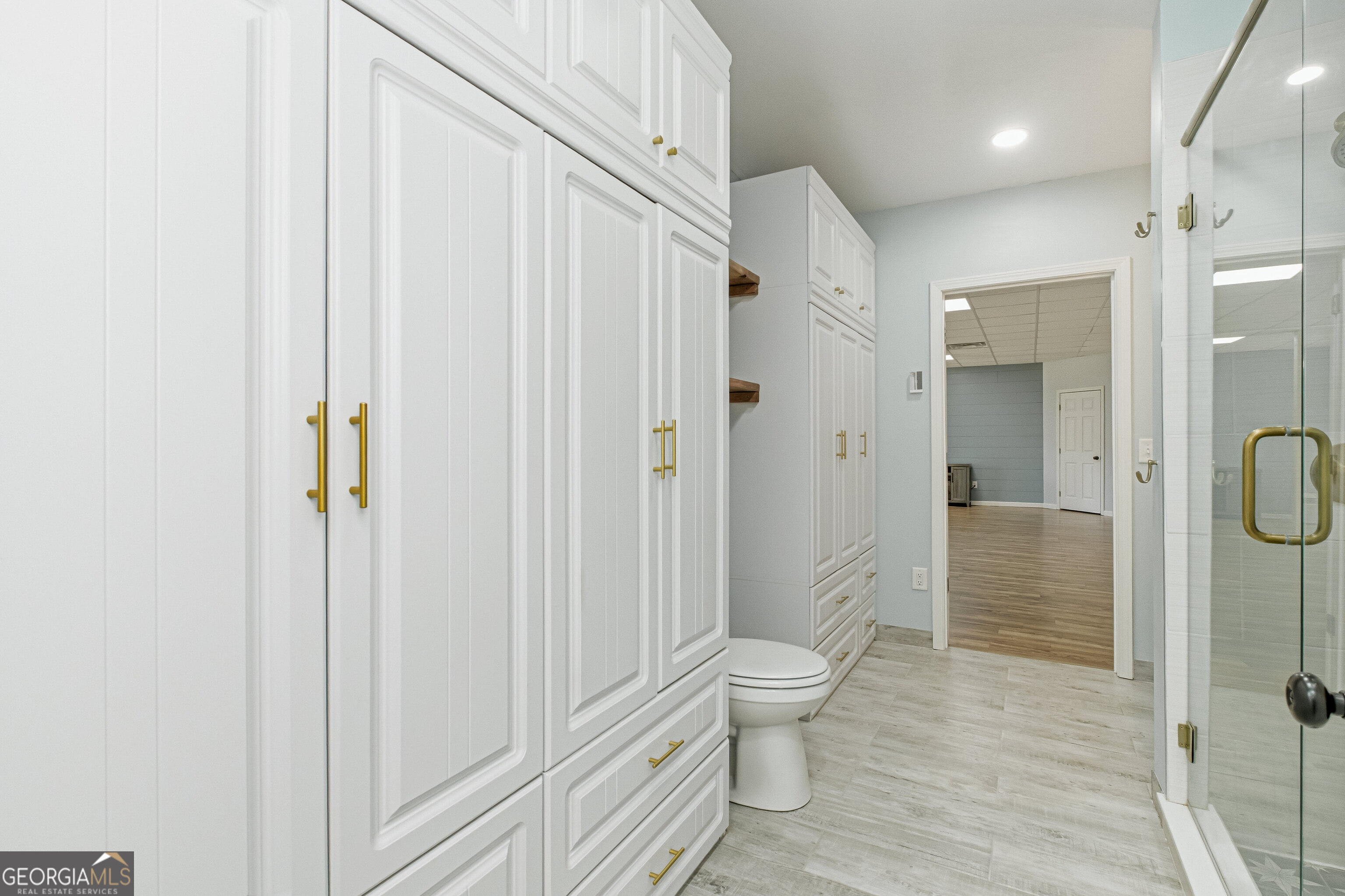 3302 Hickory Point Gainesville, GA 30506 - Photo 55 of 73 a bathroom with a toilet a sink and shower