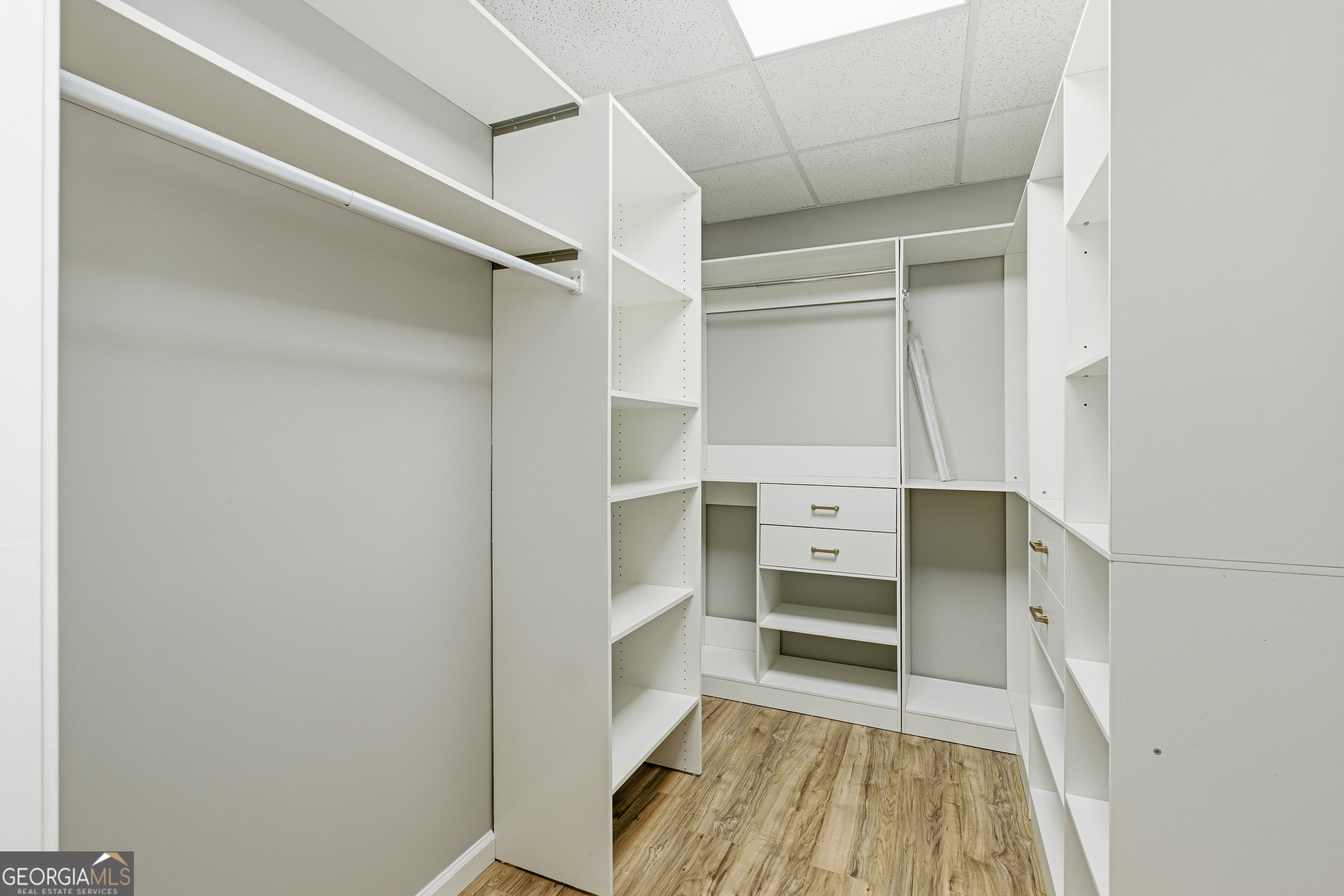 3302 Hickory Point Gainesville, GA 30506 - Photo 58 of 73 a view of walk in closet with empty racks