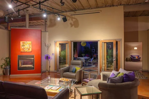 a living room with furniture and a fireplace