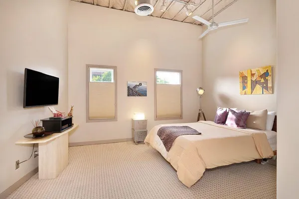 a view of a chairs and table in patio with a fire pit