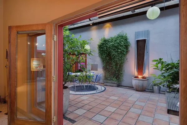 a potted plant sitting in front of a house