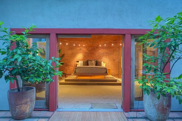 a view of an entryway with a table and chairs