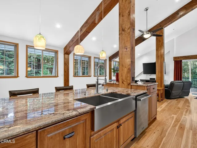 a kitchen that has a sink and a stove in it