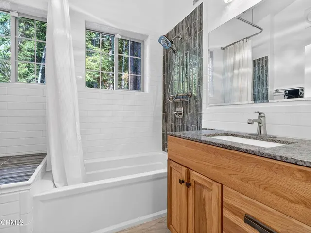 an empty room with a bookshelf and a window