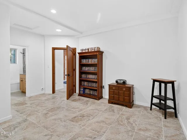 a bedroom with a large bed and a large window