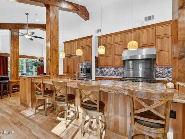a kitchen with a sink and wooden cabinets