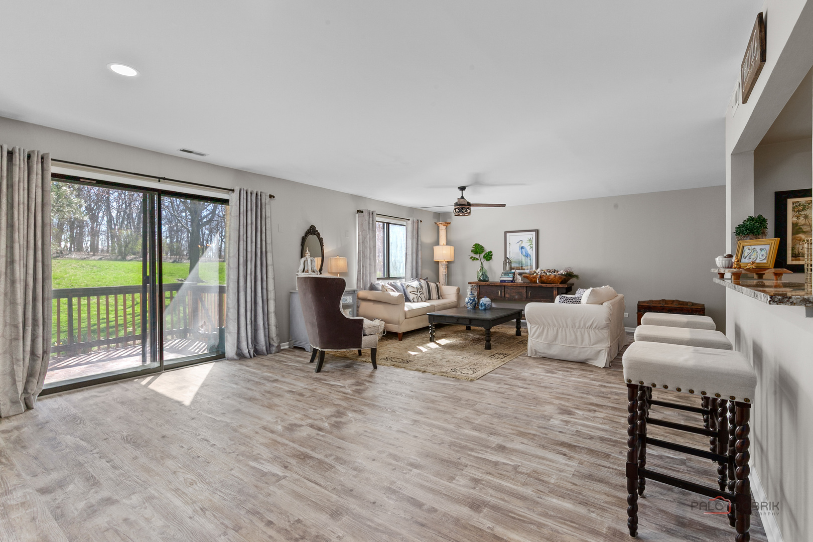 5844 Heather Ridge Drive, Unit 105 Gurnee, IL 60031 - Photo 2 of 25 a living room with furniture and a flat screen tv