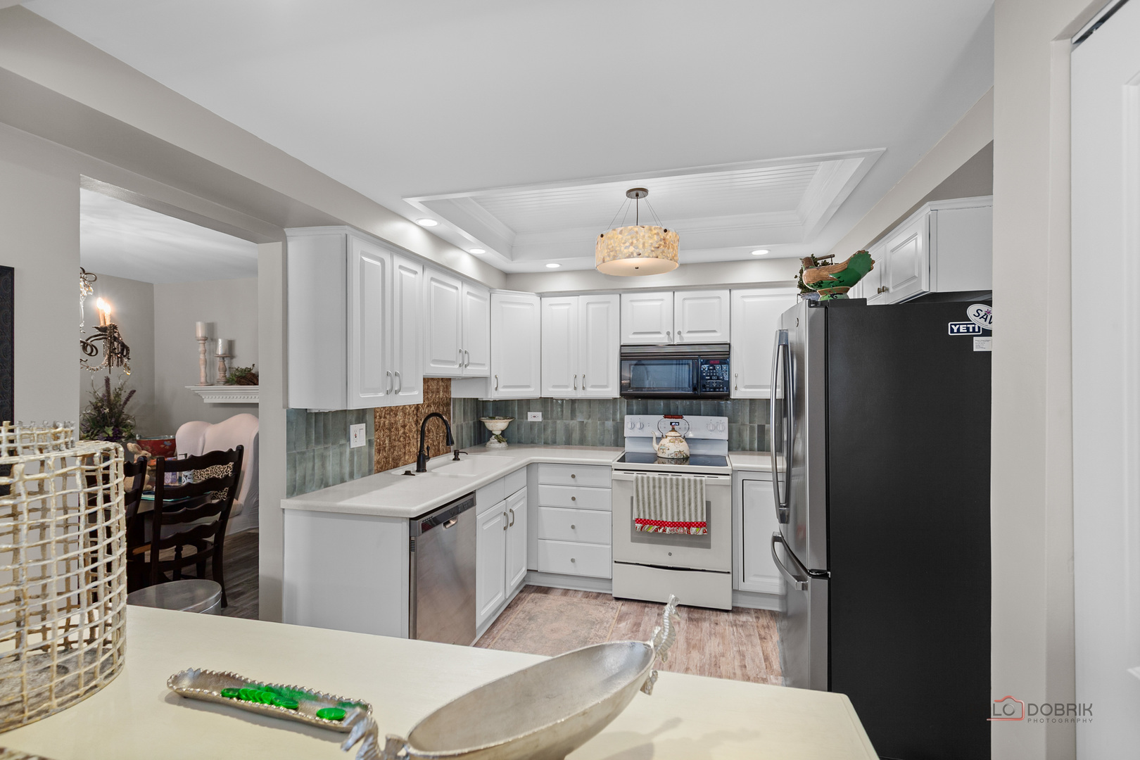 5844 Heather Ridge Drive, Unit 105 Gurnee, IL 60031 - Photo 6 of 25 a kitchen with a sink appliances and cabinets