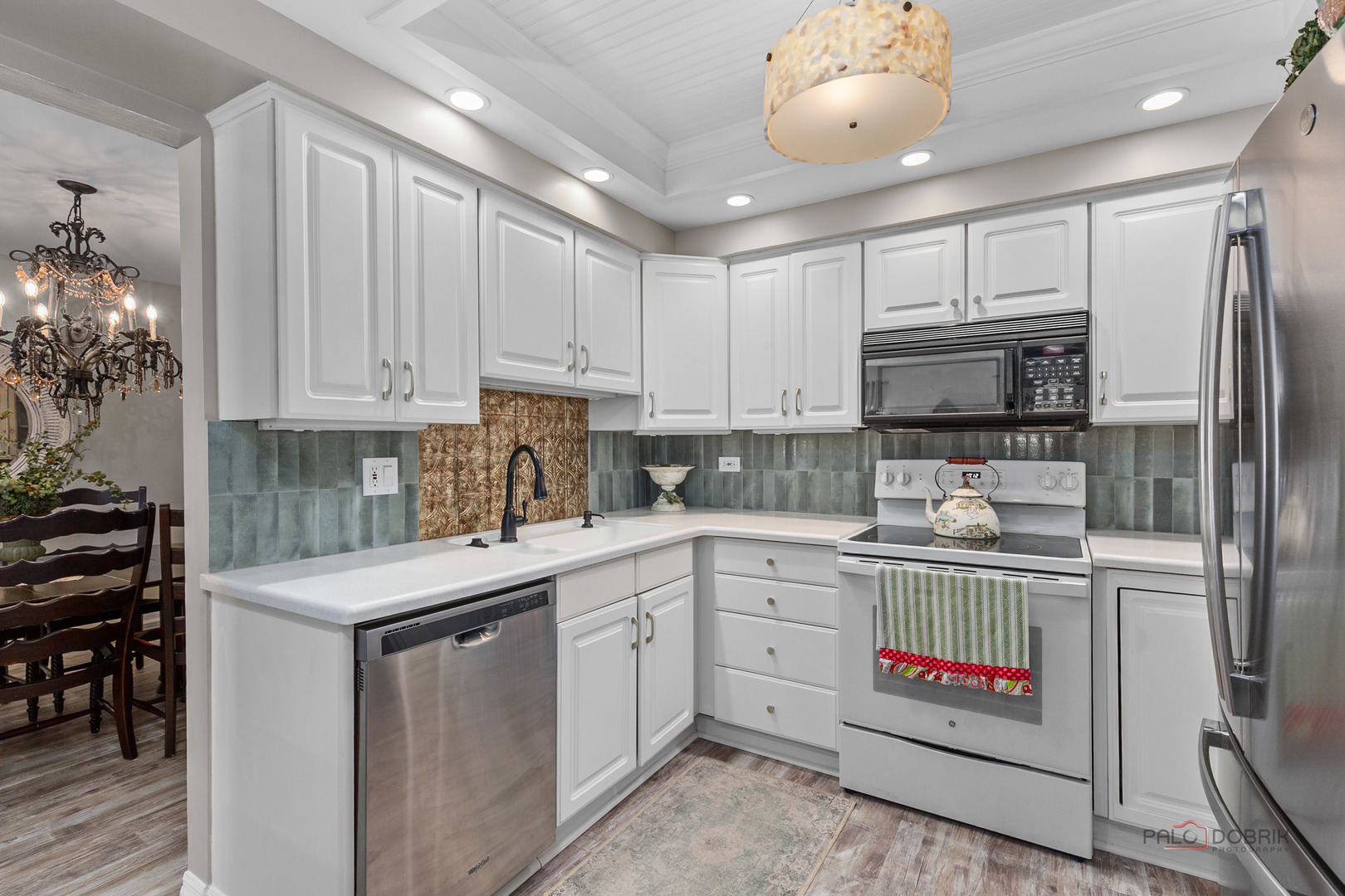 5844 Heather Ridge Drive, Unit 105 Gurnee, IL 60031 - Photo 7 of 25 a kitchen with stainless steel appliances granite countertop a sink and cabinets