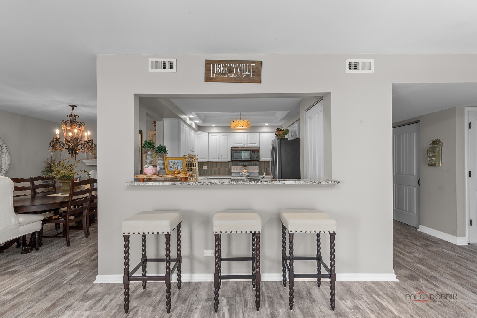 5844 Heather Ridge Drive, Unit 105 Gurnee, IL 60031 - Photo 8 of 25 a kitchen with a table and chairs in it