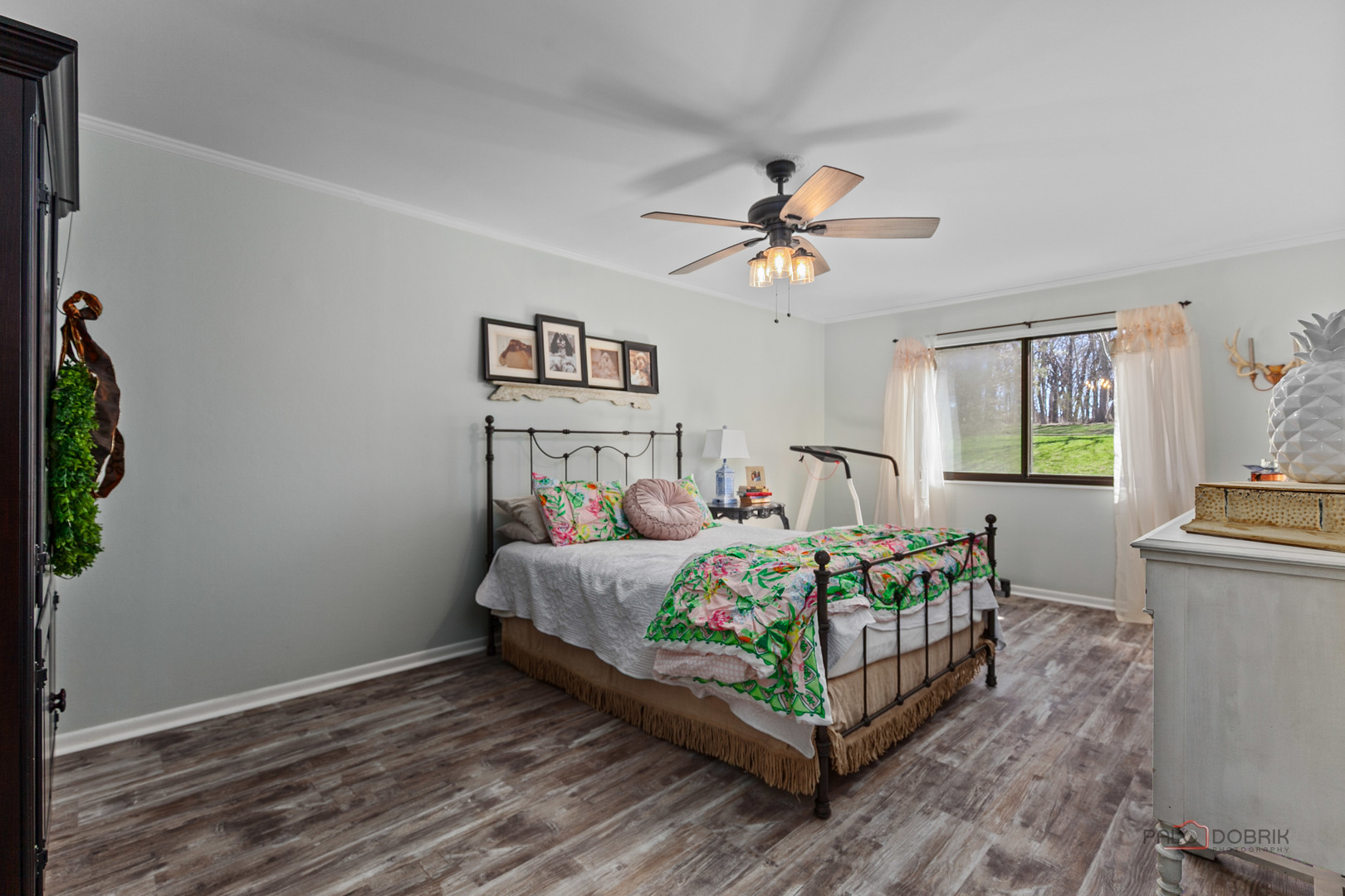 5844 Heather Ridge Drive, Unit 105 Gurnee, IL 60031 - Photo 9 of 25 a bedroom with a bed chandelier and a window