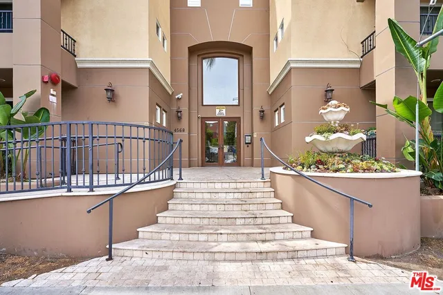 a view of a balcony with a potted plant