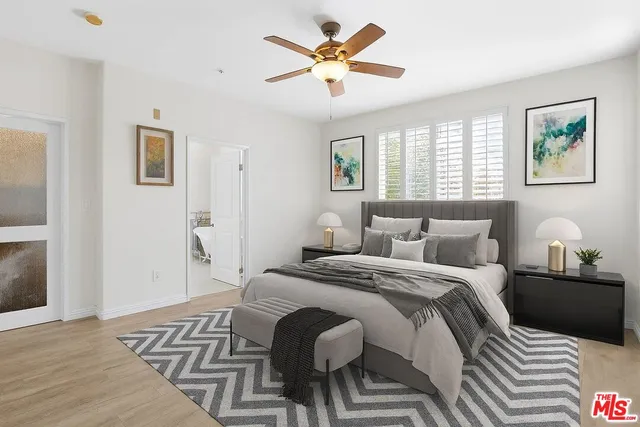 a bedroom with bed and a window