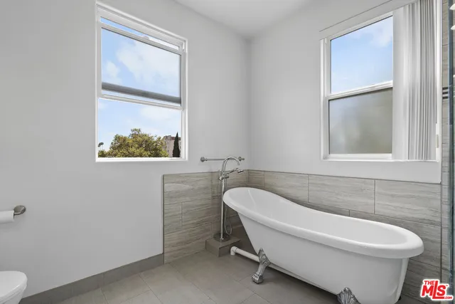 a bathroom with a toilet and a sink