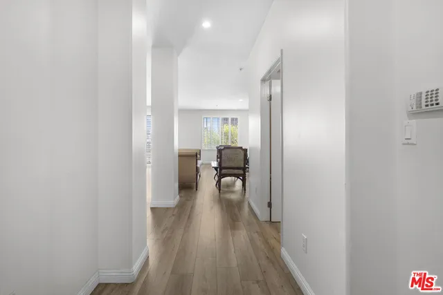 a view of utility room with wooden floor