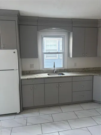 a kitchen with a sink and cabinets