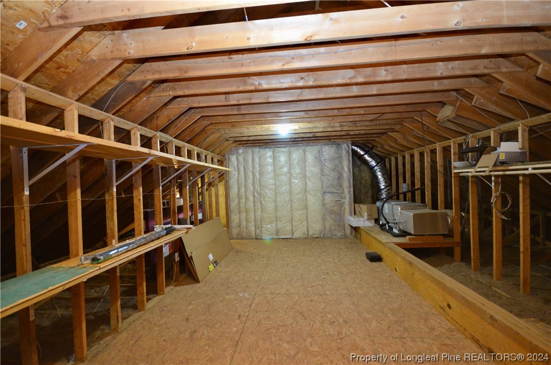 1396 Green Path Road Dunn, NC 28334 - Photo 34 of 50 a view of an empty room with racks