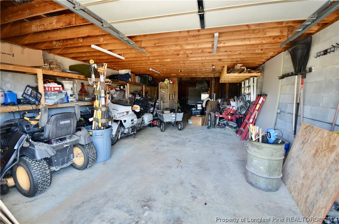 1396 Green Path Road Dunn, NC 28334 - Photo 50 of 50 a view of a storage room with a lot of stuff