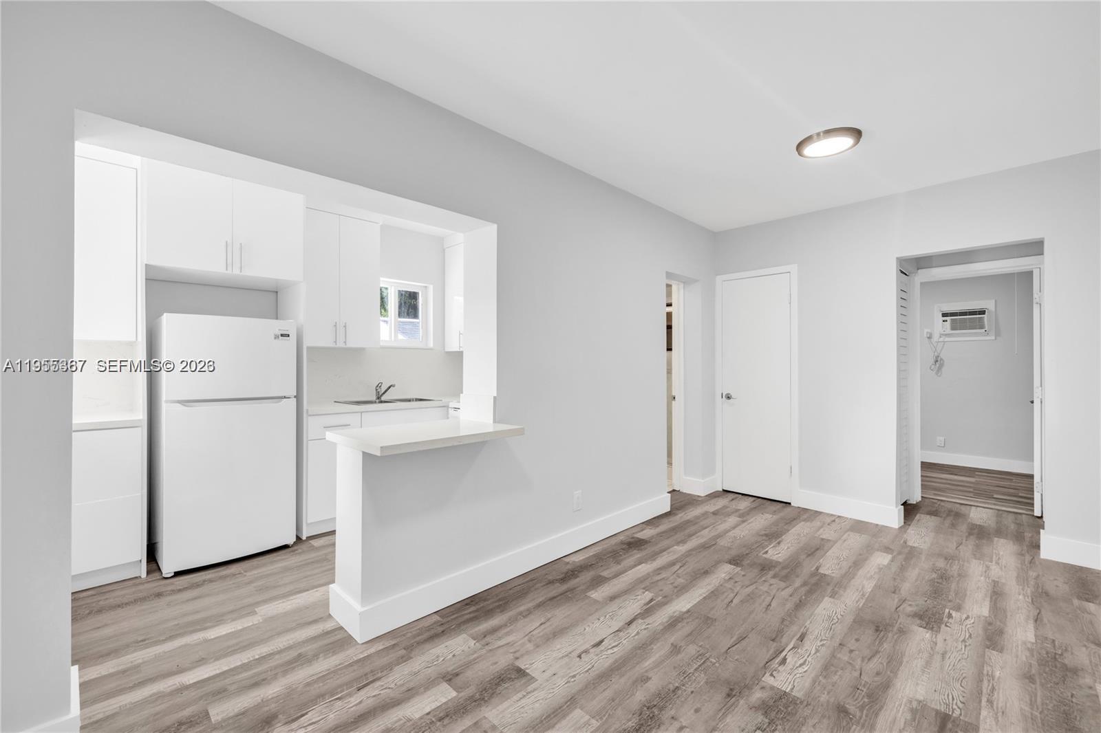 2729 Southwest 18th Street, Unit 2 Miami, FL 33145 - Photo 3 of 9 a view of an empty room with closet and a window