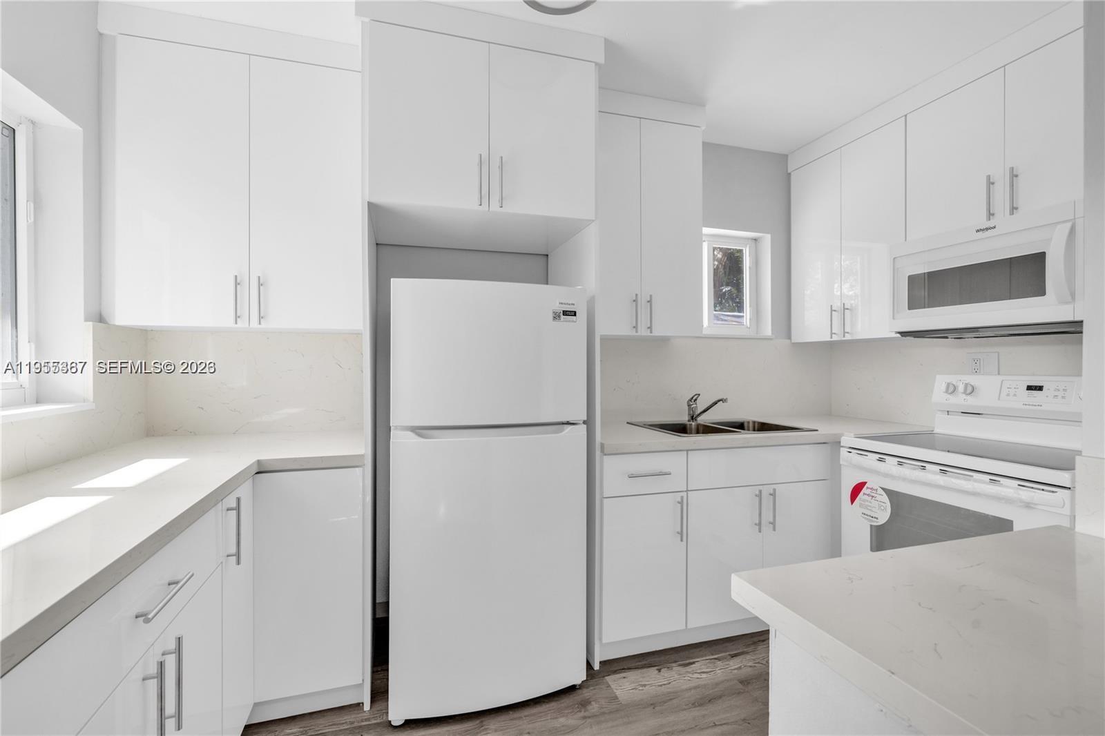 2729 Southwest 18th Street, Unit 2 Miami, FL 33145 - Photo 4 of 9 a kitchen with cabinets appliances and a sink