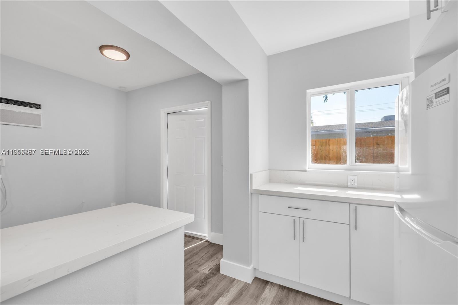 2729 Southwest 18th Street, Unit 2 Miami, FL 33145 - Photo 5 of 9 a bedroom with a bed and a window