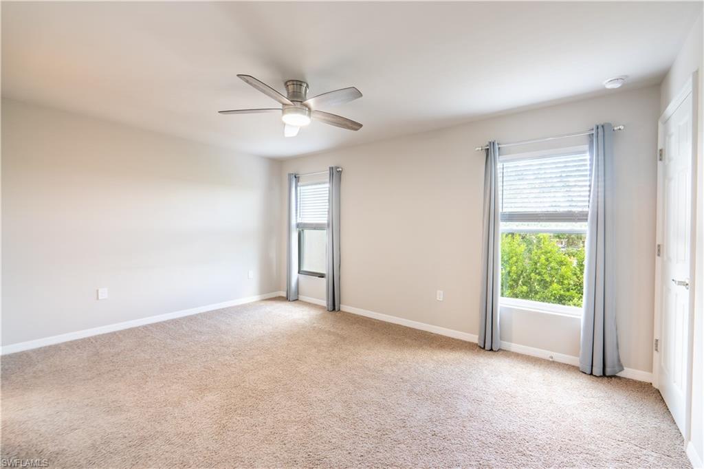 15091 Wildflower Circle Naples, FL 34119 - Photo 7 of 14 a view of an empty room with a window