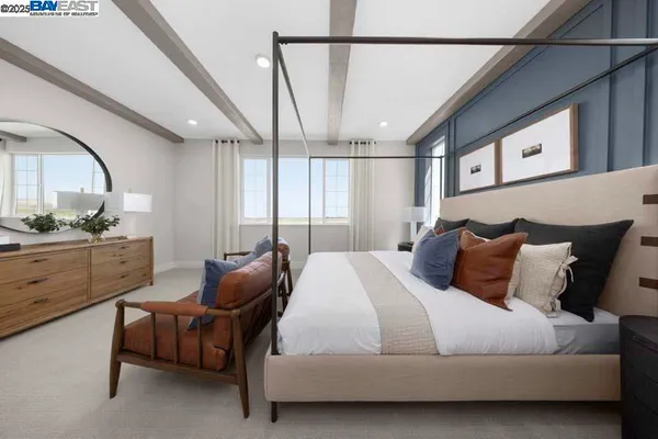 a bedroom with a bed window and couch