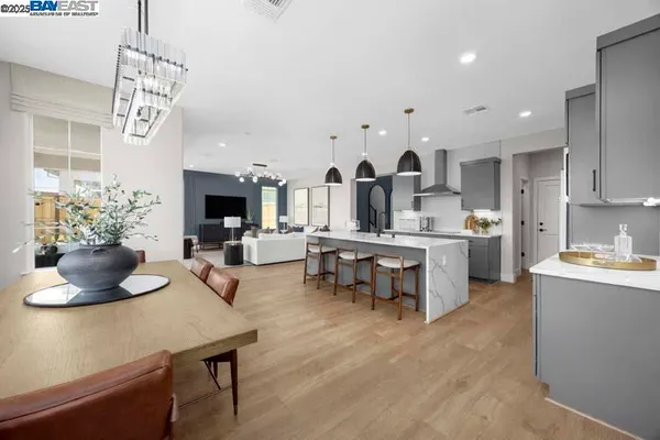 a kitchen with a sink refrigerator and cabinets
