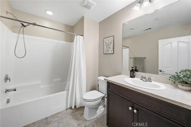 a bathroom with a sink a toilet and a bathtub
