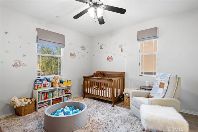 a bedroom with furniture and a window