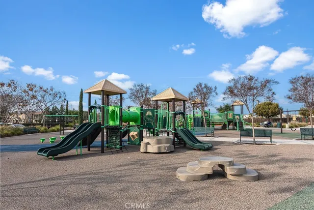 a living room with fireplace furniture and a flat screen tv