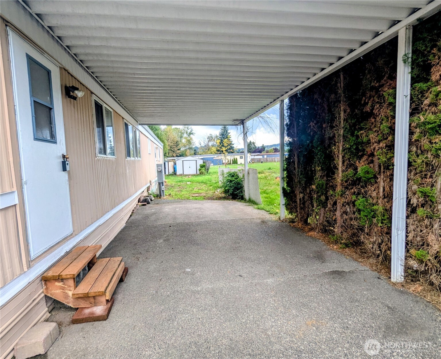 5600 Mt Solo Road, Unit 77 Longview, WA 98632 - Photo 3 of 22 a view of a porch with furniture and yard