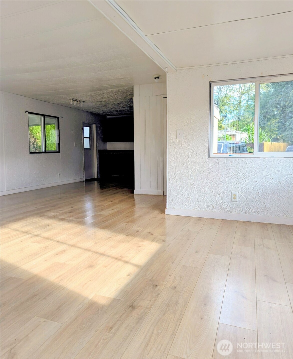 5600 Mt Solo Road, Unit 77 Longview, WA 98632 - Photo 10 of 22 a view of an empty room with a window and kitchen area